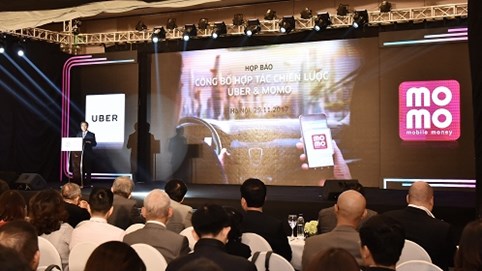 Uber bắt tay cùng MoMo phát triển thanh toán điện tử