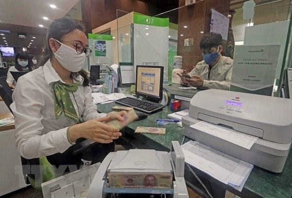 Nhiều ng&acirc;n h&agrave;ng đ&atilde; b&aacute;o c&aacute;o kết quả kinh doanh nửa đầu năm tương đối lạc quan. Ảnh minh họa: TTXVN