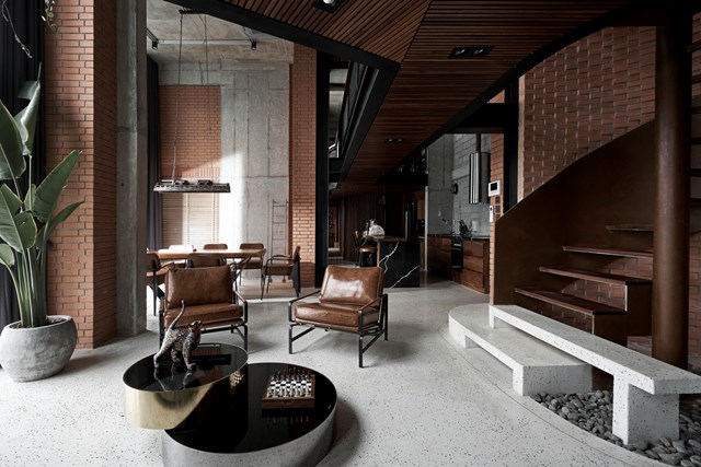 Nằm ở trung t&acirc;m căn hộ l&agrave;&nbsp;hai chiếc ghế m&agrave;u da đối diện với sofa m&agrave;u x&aacute;m gi&uacute;p kh&ocirc;ng gian phong ph&uacute; về m&agrave;u sắc đồng thời vẫn giữ được nguy&ecirc;n tắc tối giản. .